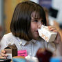 Morgan Barnett, 7, drinks from containers of 1 percent milk and chocolate milk during lunch at a school in St. Paul, Minn., in 2006. Morgan Barnett, 7, drinks from containers of 1 percent milk and chocolate milk during lunch at a school in St. Paul, Minn., in 2006.