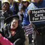 Protesters march on the Texas Capitol in Austin on March 5, demanding that lawmakers expand Medicaid to include an additional 1.5 million poor people. Protesters march on the Texas Capitol in Austin on March 5, demanding that lawmakers expand Medicaid to include an additional 1.5 million poor people.