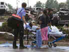 A Moore Medical Center patient sits in the parking lot after a tornado damaged the hospital on Monday. A Moore Medical Center patient sits in the parking lot after a tornado damaged the hospital on Monday.
