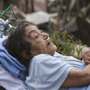 A Moore Medical Center patient sits in the parking lot after a tornado damaged the hospital on Monday. A Moore Medical Center patient sits in the parking lot after a tornado damaged the hospital on Monday.