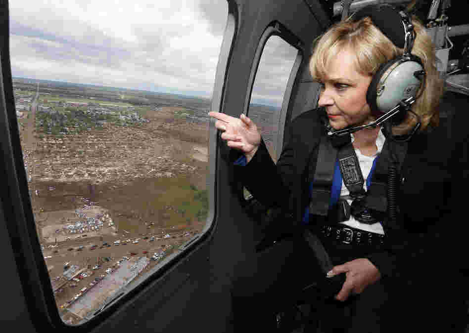 Oklahoma Gov. Mary Fallin looks out the window of a National Guard helicopter as she tours the tornado damage in Moore, Okla., on Tuesday.