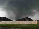 A tornado moves past homes in Moore, Okla. on Monday. A tornado moves past homes in Moore, Okla. on Monday.