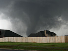 A tornado moves past homes in Moore, Okla. on Monday. A tornado moves past homes in Moore, Okla. on Monday.