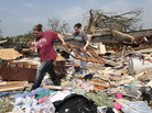 Aid groups are mobilizing relief efforts to help victims of the storm. Here, Candice Lopez, left, and Stephanie Davis help clean debris from Thelma Cox's mobile home near Shawnee, Okla., after it was destroyed Monday. Aid groups are mobilizing relief efforts to help victims of the storm. Here, Candice Lopez, left, and Stephanie Davis help clean debris from Thelma Cox's mobile home near Shawnee, Okla., after it was destroyed Monday.
