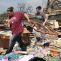 Aid groups are mobilizing relief efforts to help victims of the storm. Here, Candice Lopez, left, and Stephanie Davis help clean debris from Thelma Cox's mobile home near Shawnee, Okla., after it was destroyed Monday. Aid groups are mobilizing relief efforts to help victims of the storm. Here, Candice Lopez, left, and Stephanie Davis help clean debris from Thelma Cox's mobile home near Shawnee, Okla., after it was destroyed Monday.