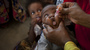 A baby receives a polio vaccine at the Medina Maternal Child Health center in Mogadishu, Somalia. The country has one of the lowest immunization rates in the world.