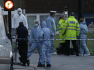 Police and forensic officers near the scene of Wednesday's brutal attack. Police and forensic officers near the scene of Wednesday's brutal attack.