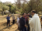 Ibrahim Shomali, a Palestinian priest, offers Communion under the olive trees of the Cremisan Valley in the Israeli-occupied West Bank. This is part of a regular protest against Israeli plans to build a section of its West Bank barrier here, which would separate Palestinians from their agricultural lands. Ibrahim Shomali, a Palestinian priest, offers Communion under the olive trees of the Cremisan Valley in the Israeli-occupied West Bank. This is part of a regular protest against Israeli plans to build a section of its West Bank barrier here, which would separate Palestinians from their agricultural lands.