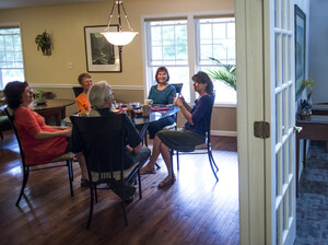 Group houses are becoming popular â again â among some single baby boomers, and not just for financial reasons. Marianne Kilkenny (second from right) shares her home in Asheville, N.C, with four other people. Group houses are becoming popular â again â among some single baby boomers, and not just for financial reasons. Marianne Kilkenny (second from right) shares her home in Asheville, N.C, with four other people.