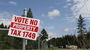 A yard sign opposes a local tax increase to fund public safety in Josephine County, Oregon. The ballot measure reportedly failed by a thin margin.
