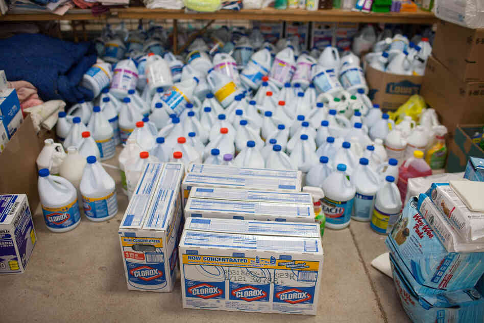 Containers of donated cleaning supplies, kitty litter and other necessities occupy one area of the shelter.