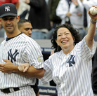 Sotomayor is escorted onto the field by New York Yankees catcher Jorge Posada to throw out the ceremonial first pitch before the New York Yankees game against the Boston Red Sox at Yankee Stadium on Sept. 26, 2009. Sotomayor is escorted onto the field by New York Yankees catcher Jorge Posada to throw out the ceremonial first pitch before the New York Yankees game against the Boston Red Sox at Yankee Stadium on Sept. 26, 2009.