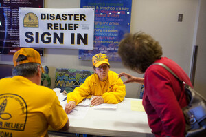 Sue McClure, a volunteer with Disaster Relief of Oklahoma, assists tornado victims Wednesday at the First Baptist Church in Moore, Okla. Sue McClure, a volunteer with Disaster Relief of Oklahoma, assists tornado victims Wednesday at the First Baptist Church in Moore, Okla.