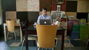 Nay Aung, founder of Oway, a tech startup in Yangon, Myanmar, sits in Taste Cafe, which served as his unofficial office for his first few months in the country. He had to start his business here because it was one of the few places with a stabile Internet connection.