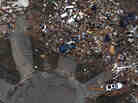 An aerial photo shows destroyed houses in Moore, Okla., after Monday's tornado. Rena and Paul Phillips, who lost their home in the storm, also lost a house to a tornado in 1999.