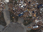 An aerial photo shows destroyed houses in Moore, Okla., after Monday's tornado. Rena and Paul Phillips, who lost their home in the storm, also lost a house to a tornado in 1999. An aerial photo shows destroyed houses in Moore, Okla., after Monday's tornado. Rena and Paul Phillips, who lost their home in the storm, also lost a house to a tornado in 1999.