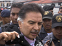 Former Guatemalan President Alfonso Portillo speaks with journalists on Friday in Guatemala City, before boarding a plane for the U.S.