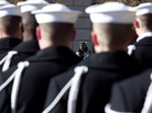 U.S. Navy sailors form a ceremonial guard at a wreath-laying ceremony to memorialize the victims of the attack on Pearl Harbor and pay tribute to the veterans of World War II in front of the Lone Sailor statue at the Naval Memorial in Washington, D.C., in December 2003. U.S. Navy sailors form a ceremonial guard at a wreath-laying ceremony to memorialize the victims of the attack on Pearl Harbor and pay tribute to the veterans of World War II in front of the Lone Sailor statue at the Naval Memorial in Washington, D.C., in December 2003.