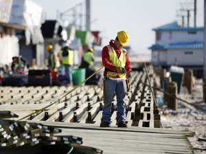 Construction workers work to rebuild the boardwalk in Seaside Heights in anticipation of Memorial Day weekend. Construction workers work to rebuild the boardwalk in Seaside Heights in anticipation of Memorial Day weekend.