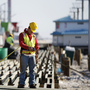 Construction workers work to rebuild the boardwalk in Seaside Heights in anticipation of Memorial Day weekend.