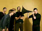Modest Mouse frontman Isaac Brock uses a massive ear trumpet to really listen.