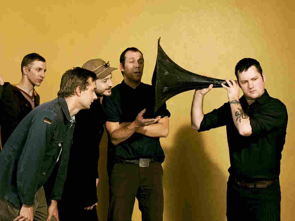 Modest Mouse frontman Isaac Brock uses a massive ear trumpet to really listen. Modest Mouse frontman Isaac Brock uses a massive ear trumpet to really listen.