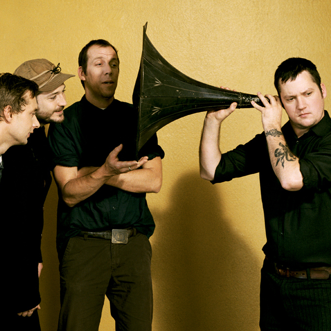 Modest Mouse frontman Isaac Brock uses a massive ear trumpet to really listen.
