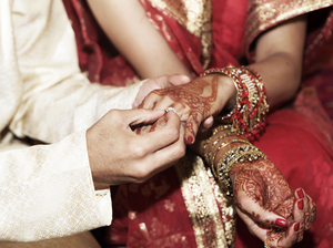 A bride and groom exchange rings during a traditional Indian wedding ceremony. Although most marriages in India are still arranged by parents, a growing number of women are taking matters of the heart into their own hands, using dating services and websites. A bride and groom exchange rings during a traditional Indian wedding ceremony. Although most marriages in India are still arranged by parents, a growing number of women are taking matters of the heart into their own hands, using dating services and websites.