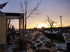 Rita Green carried a plastic bin of items as she helped a family friend salvage things from a home Thursday in Moore, Okla. Rita Green carried a plastic bin of items as she helped a family friend salvage things from a home Thursday in Moore, Okla.