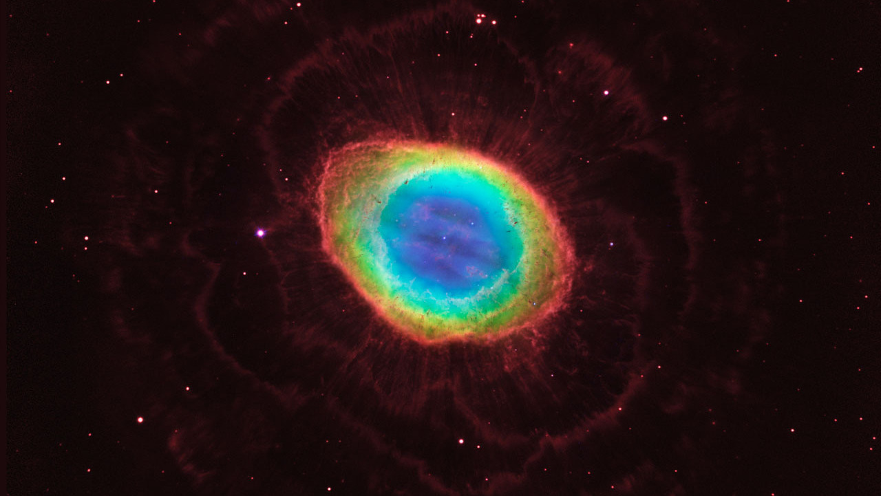 The famous Ring Nebula is shown here in striking detail, in a composite image made from images from NASA's Hubble Space Telescope and infrared data from telescopes on Earth.