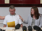 As Ian Rigby spoke Friday about his stepson Lee, a British soldier who was murdered on a south London street this week, the young man's widow, Rebecca (right), and his mother, Lyn, reached out. As Ian Rigby spoke Friday about his stepson Lee, a British soldier who was murdered on a south London street this week, the young man's widow, Rebecca (right), and his mother, Lyn, reached out.