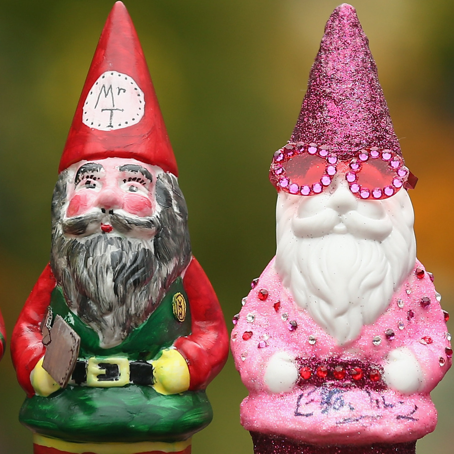 Decorated gnomes designed by celebrities, including Elton John (second from the right), are displayed at Chelsea Flower Show on Monday in London.