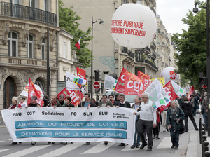 Demonstrators in Paris protest Thursday against a measure to teach more university courses in English. Demonstrators in Paris protest Thursday against a measure to teach more university courses in English.
