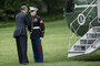 President Obama greets a Marine after forgetting to salute him while boarding Marine One on the South Lawn of the White House in Washington, D.C.