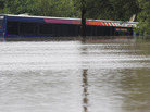 A San Antonio metro bus sits in floodwaters after it was swept off the road during heavy rains on Saturday. A San Antonio metro bus sits in floodwaters after it was swept off the road during heavy rains on Saturday.