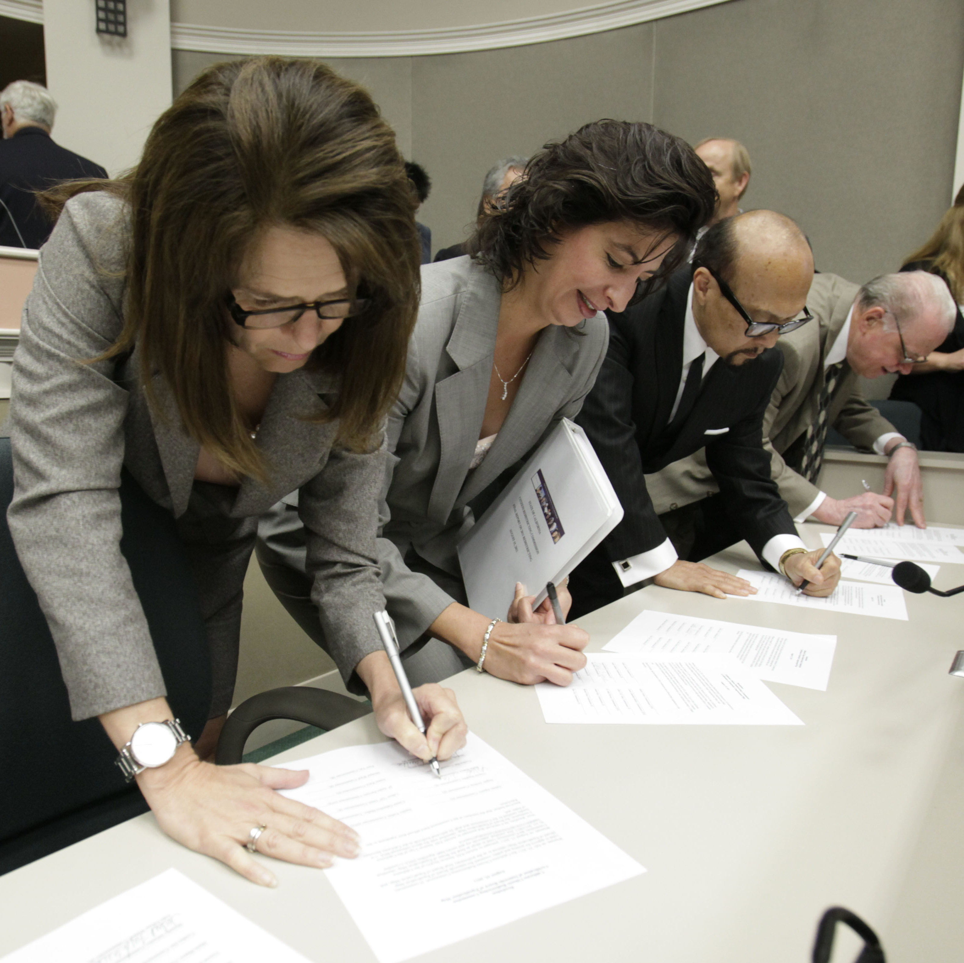 California Citizens Redistricting Commission members sign resolutions certifying the final vote for new legislative and congressional maps at the Capitol in Sacramento in 2011.