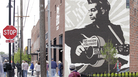 Outside the Woody Guthrie Center, there's a large mural of Guthrie holding his guitar bearing the phrase, "This Machine Kills Fascists." Outside the Woody Guthrie Center, there's a large mural of Guthrie holding his guitar bearing the phrase, "This Machine Kills Fascists."