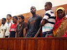A Nov. 23, 2010, photo shows Michael Adebolajo (center, in dark T-shirt) with suspected Al-Shabab recruits who were arrested by Kenyan police. Adebolajo, one of the main suspects in the brutal murder of a soldier in London, was discharged from the hospital Tuesday. A Nov. 23, 2010, photo shows Michael Adebolajo (center, in dark T-shirt) with suspected Al-Shabab recruits who were arrested by Kenyan police. Adebolajo, one of the main suspects in the brutal murder of a soldier in London, was discharged from the hospital Tuesday.