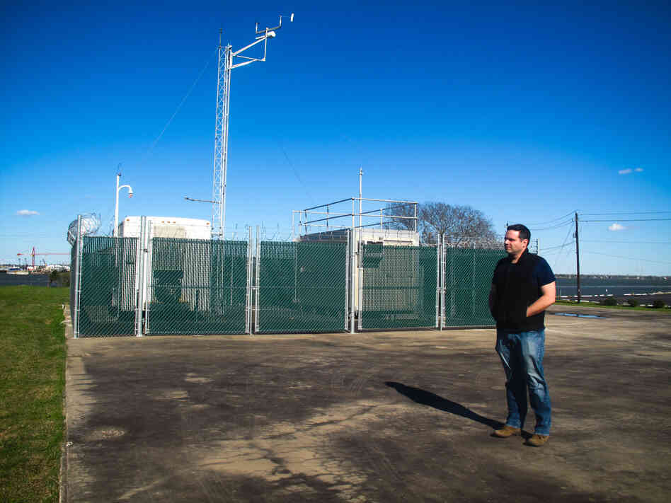 Matthew Tejada stands near an air monitoring station. Matthew Tejada stands near an air monitoring station.