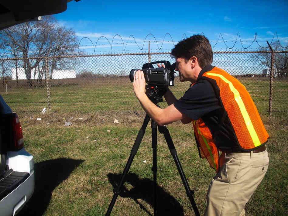Jason Harris, with the Texas Commission for Environmental Quality, uses an infrared camera to find leaks at a chemical facility near the Houston Ship Channel. The specialty cameras cost around $100,000. Jason Harris, with the Texas Commission for Environmental Quality, uses an infrared camera to find leaks at a chemical facility near the Houston Ship Channel. The specialty cameras cost around $100,000.