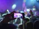 Screenshot from Apple's "Photos Every Day" iPhone 5 ad picturing a scene from the Yeah Yeah Yeahs performing at NPR Music's SXSW 2013 Stubbs Showcase. Screenshot from Apple's "Photos Every Day" iPhone 5 ad picturing a scene from the Yeah Yeah Yeahs performing at NPR Music's SXSW 2013 Stubbs Showcase.