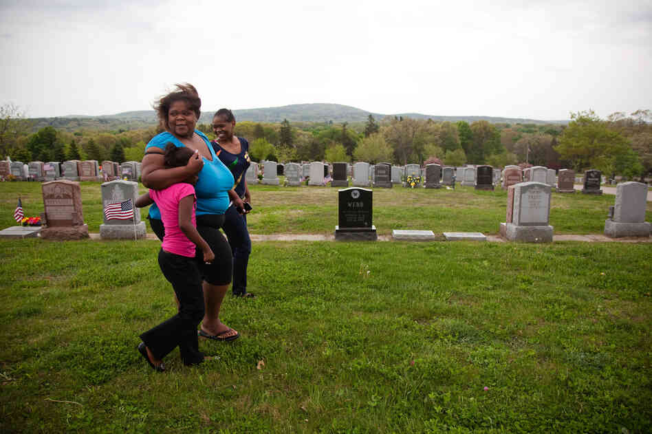 Michelle Williams (center) and two daughters visit the grave of her mother, Judy Williams, at Fairview Cemetery in Hyde Park, Mass., on May 11. Judy died in 2011. Michelle Williams (center) and two daughters visit the grave of her mother, Judy Williams, at Fairview Cemetery in Hyde Park, Mass., on May 11. Judy died in 2011.