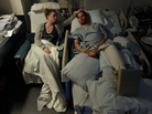 Jen Regan strokes the head of her fiancée, Marc Fucarile, as he sleeps in his hospital bed at Massachusetts General Hospital. Fucarile was injured in the bombings at the Boston Marathon, and had to have his right leg amputated. Jen Regan strokes the head of her fiancée, Marc Fucarile, as he sleeps in his hospital bed at Massachusetts General Hospital. Fucarile was injured in the bombings at the Boston Marathon, and had to have his right leg amputated.