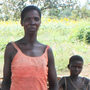 Grace Aber stands in the shade of a mango tree with her children in the remote village of Tumangu in northern Uganda. Four of Aber's nine children have been diagnosed with nodding syndrome, starting with Partick (front), who first showed symptoms in 2002. Grace Aber stands in the shade of a mango tree with her children in the remote village of Tumangu in northern Uganda. Four of Aber's nine children have been diagnosed with nodding syndrome, starting with Partick (front), who first showed symptoms in 2002.