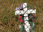 Cross on a fence Cross on a fence