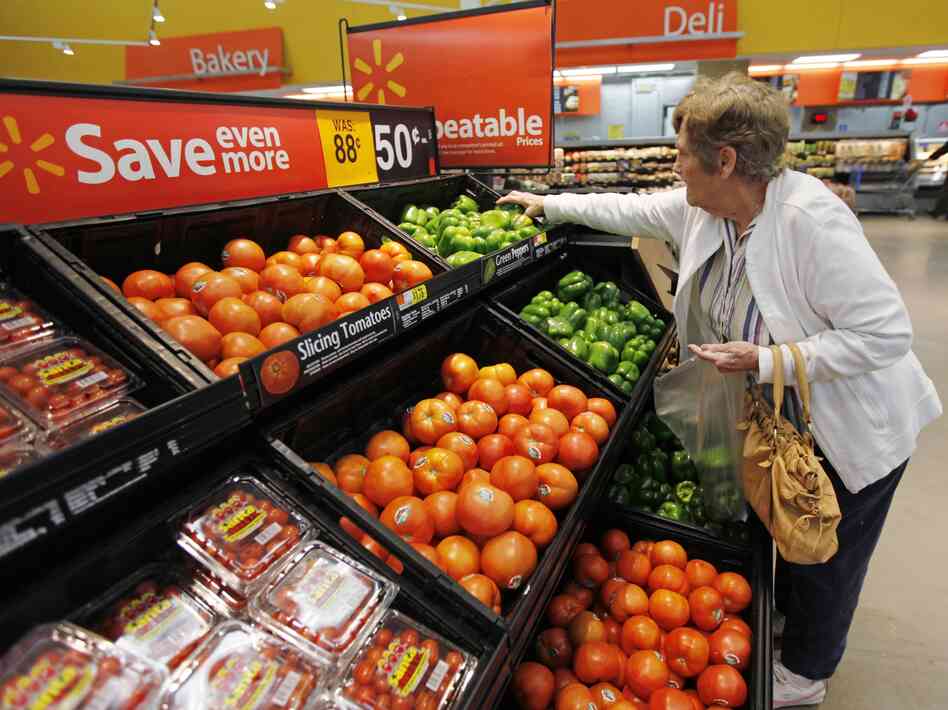 A shopper selects produce at a Wal-Mart in Deptford, N.J. A shopper selects produce at a Wal-Mart in Deptford, N.J.