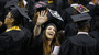 Graduates of Bowie State University wave to friends and family at the school's graduation ceremony in College Park, Md., on May 17. This year's graduates are finding better job prospects than at any time since 2008.