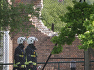 Fire officers walk past the fire-damaged Al-Rahma Islamic Centre in Muswell Hill in London Wednesday. Counter-terrorism officers have been called in amid suspicions that it was a racially motivated attack. Fire officers walk past the fire-damaged Al-Rahma Islamic Centre in Muswell Hill in London Wednesday. Counter-terrorism officers have been called in amid suspicions that it was a racially motivated attack.