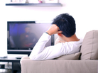 A guy watching television. A guy watching television.