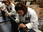 Johana Guardado assembles a laptop on Lenovo's new personal computer production line in Whitsett, N.C. Johana Guardado assembles a laptop on Lenovo's new personal computer production line in Whitsett, N.C.